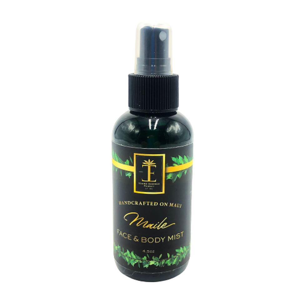 A black spray bottle labeled 'Maile Face & Body Mist' by Island Essence, featuring green leaf designs.
