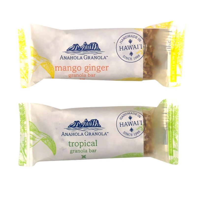 Two Anahola Granola bars, one mango ginger and one tropical, on a white background.