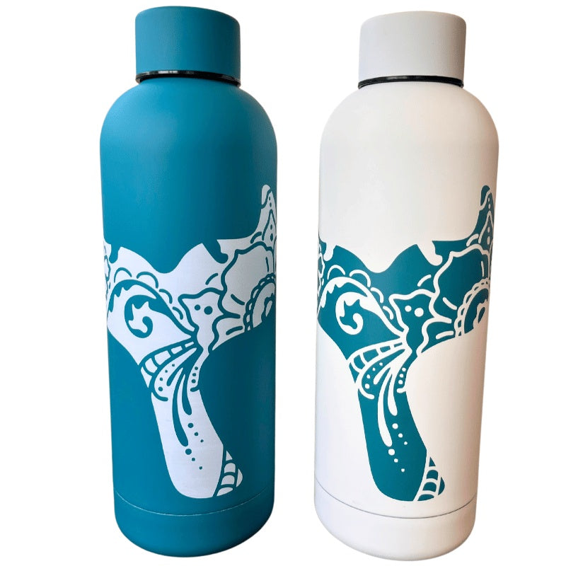 Two insulated bottles with whale tail designs, one blue and one white, on a white background.