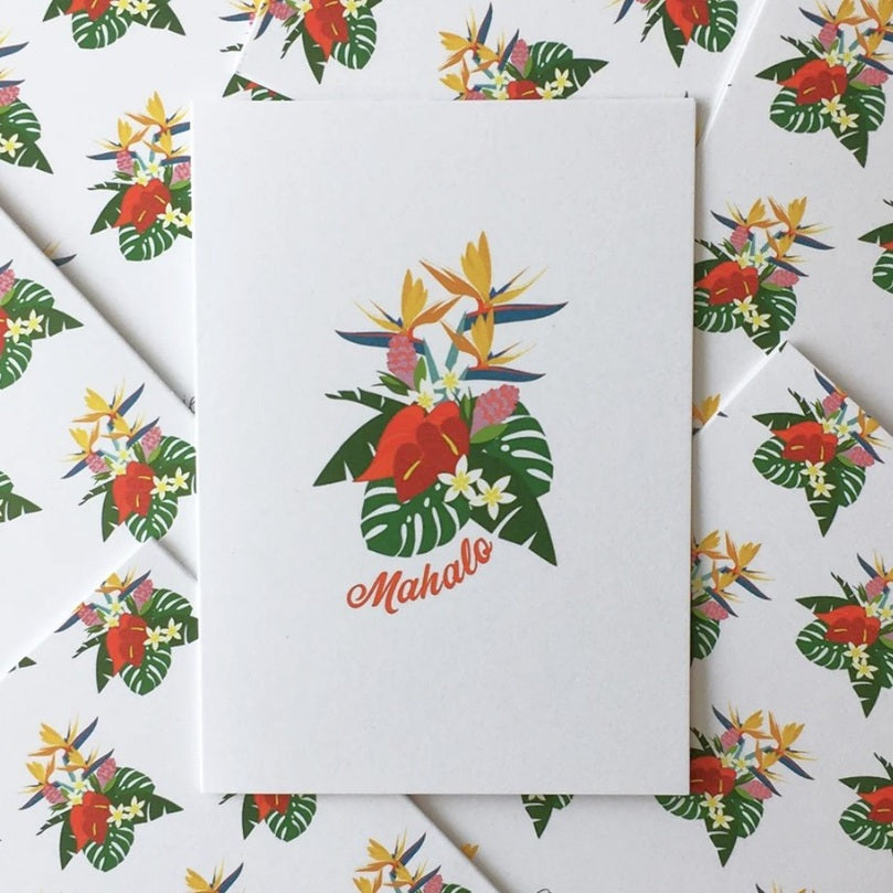 Notebook with tropical floral design and 'Mahalo' text on a white background