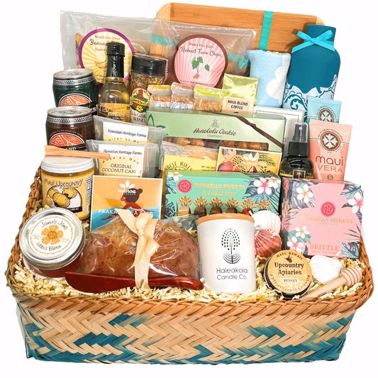 Gift basket with various products including candles, coffee, and snacks on a white background