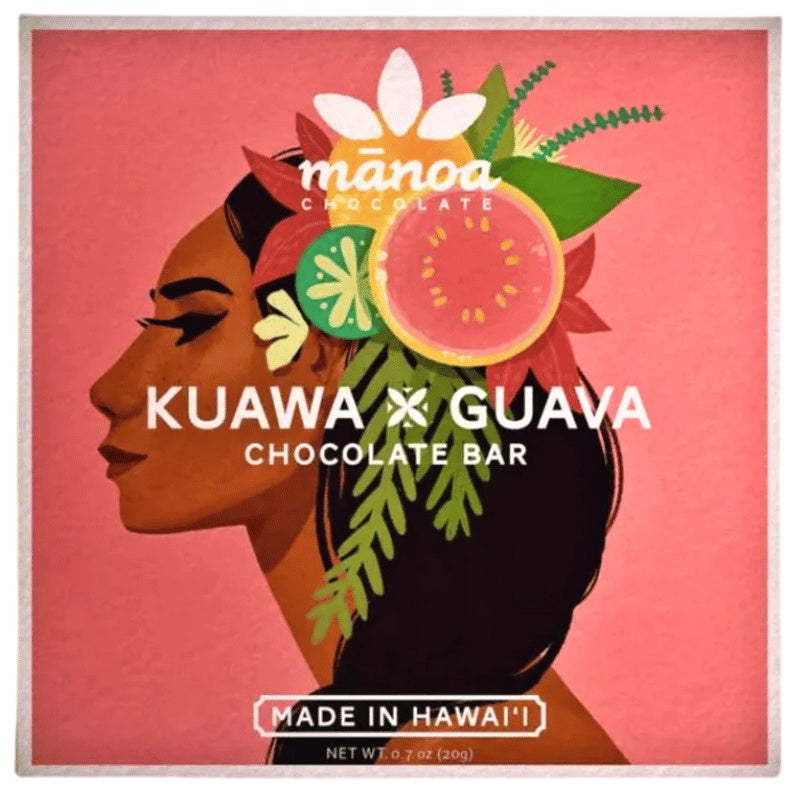 Chocolate bar packaging with a woman's profile and fruit illustration, featuring the brand 'Manoa Chocolate'.