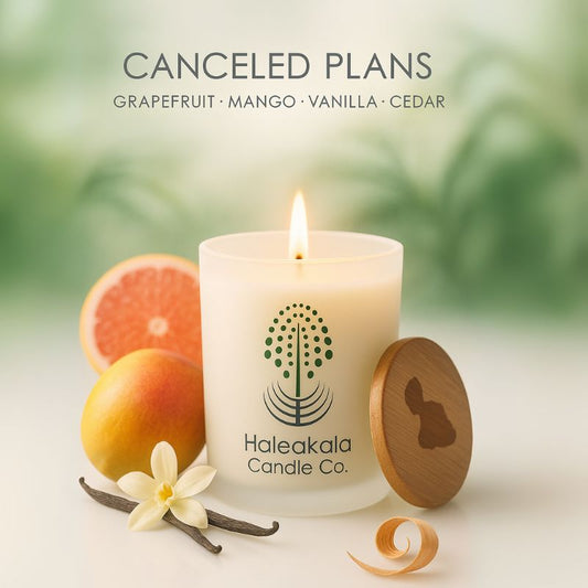 Haleakala Candle Co. candle with fruits and flowers on a light background