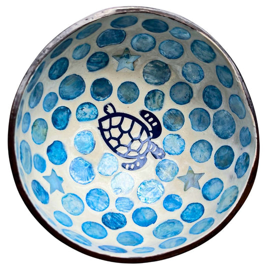 Ceramic bowl with blue dot pattern and turtle design on a white background