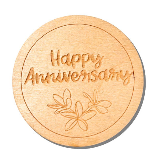 Wooden coaster with 'Happy Anniversary' engraving on a white background