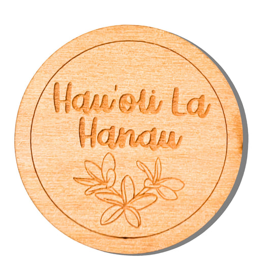 Wooden round coaster with engraved text and leaf design on a white background