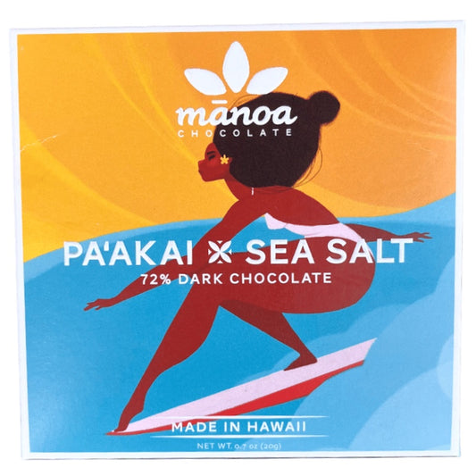 Manoa Chocolate Pa'akai Sea Salt 72% Dark Chocolate packaging with a woman on a surfboard design.
