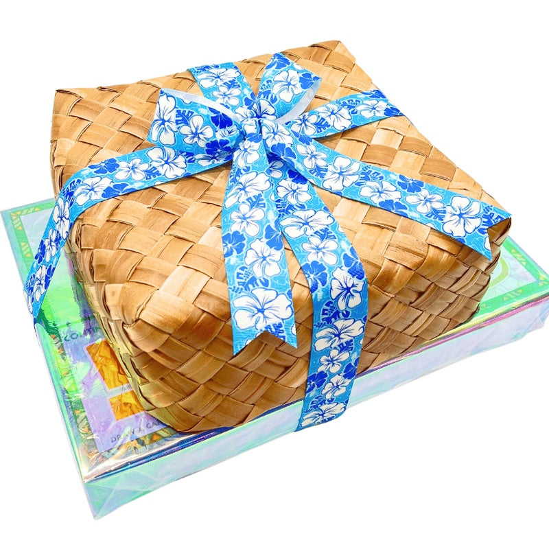 Woven basket with a blue floral ribbon on a colorful box