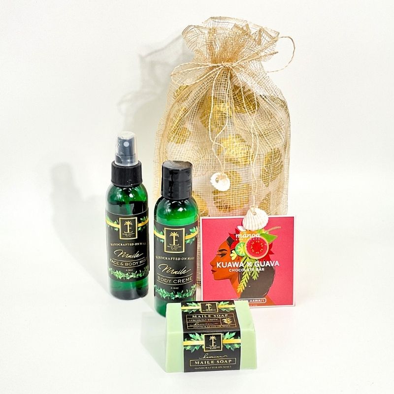 Set of skincare products including bottles, a soap bar, and a cream with a gold drawstring bag on a white background.