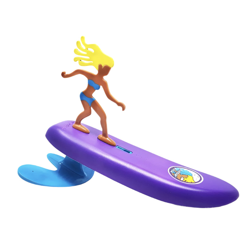 Toy figure of a surfer girl on a purple surfboard with a blue wave, on a white background.