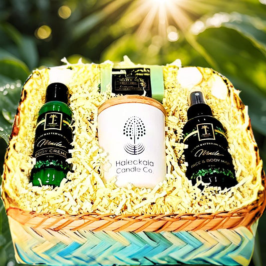 Gift basket with Haleakala Candle Co products against a natural background