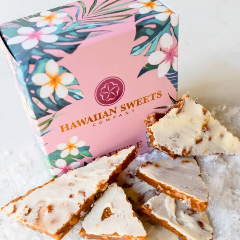 Hawaiian Sweets Company box with white chocolate macadamia brittle on a white surface